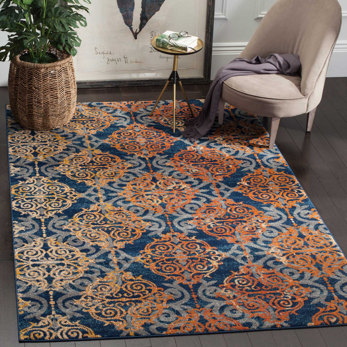 Orange and beige medallions enliven the deep blue rug beneath an accent chair.