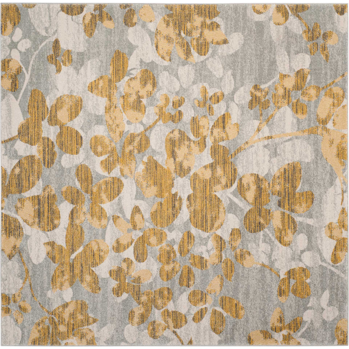 A square gray rug comes alive with golden floral sprays and softly weathered texture