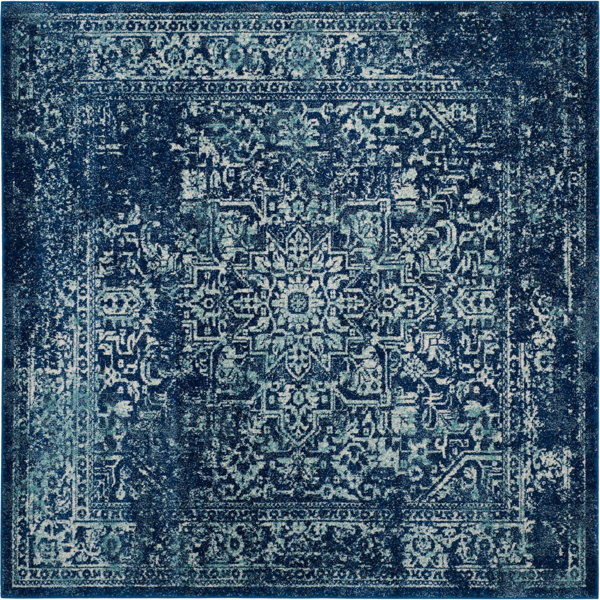 Square navy and ivory rug with a dramatic floral medallion and patterned border