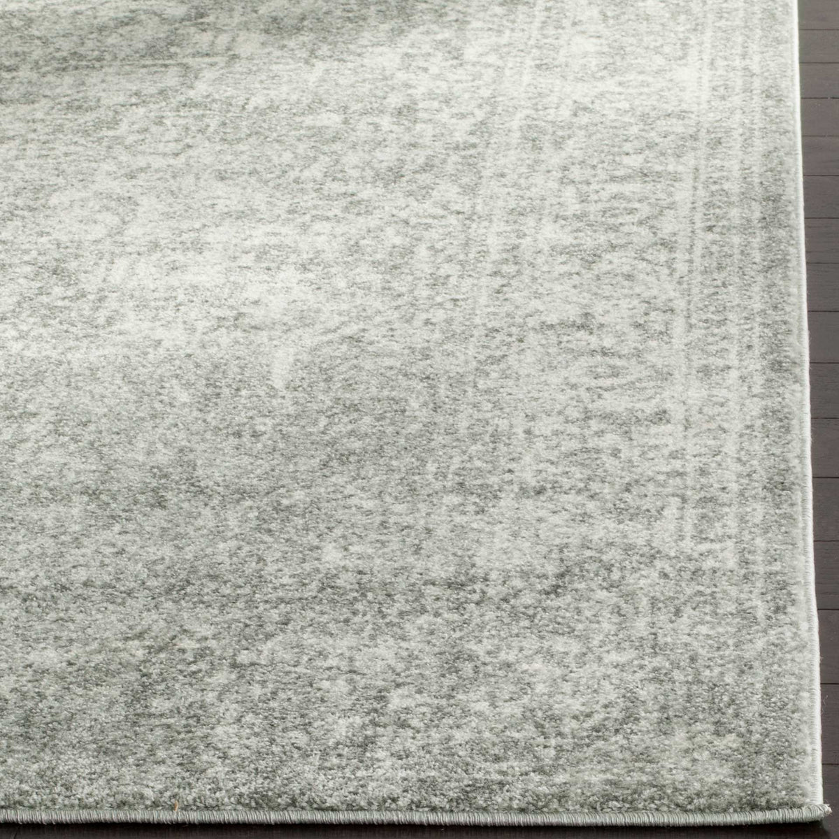 Low silver and ivory pile shows subtle variations in tone beside a clean bound edge