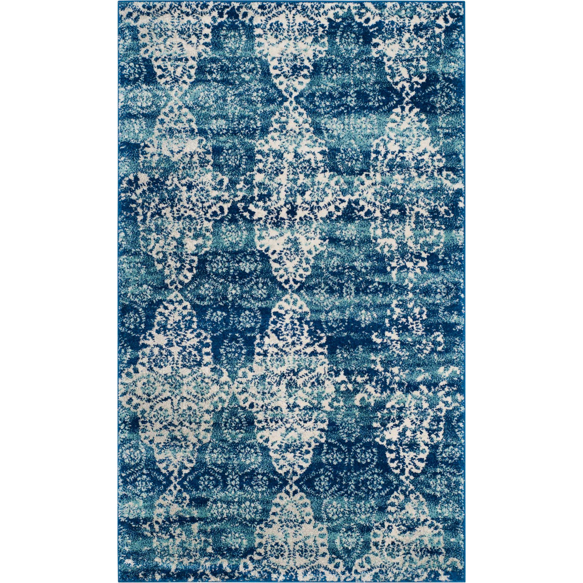 Compact royal blue rug with ivory floral scrollwork and vintage-inspired distressing