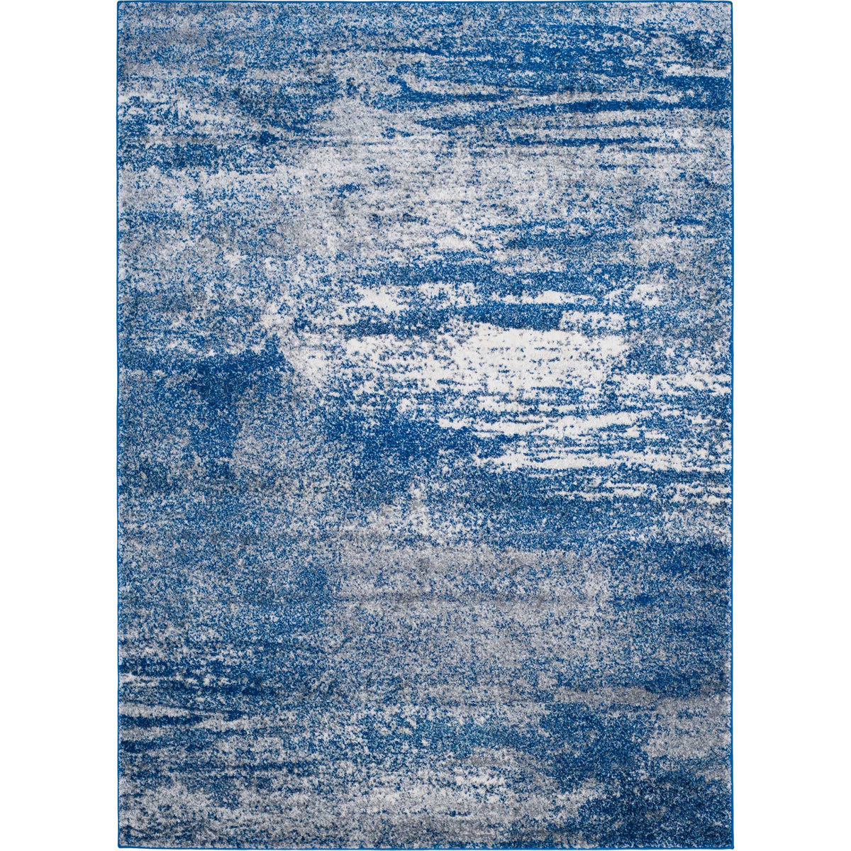 Sweeping navy streaks and mottled ivory give this rectangular rug a layered, modern look.