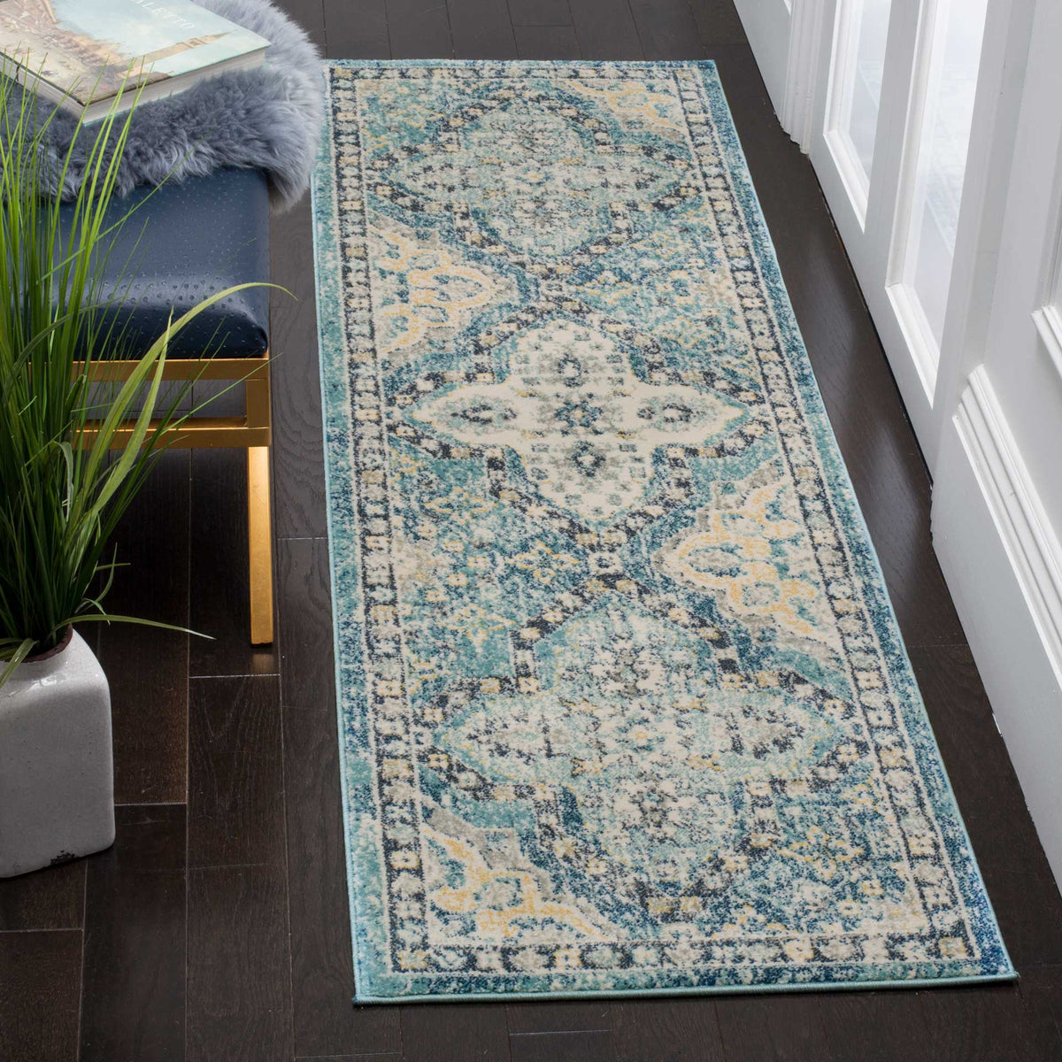 Vintage-inspired blue and ivory runner with intricate floral motifs for narrow spaces