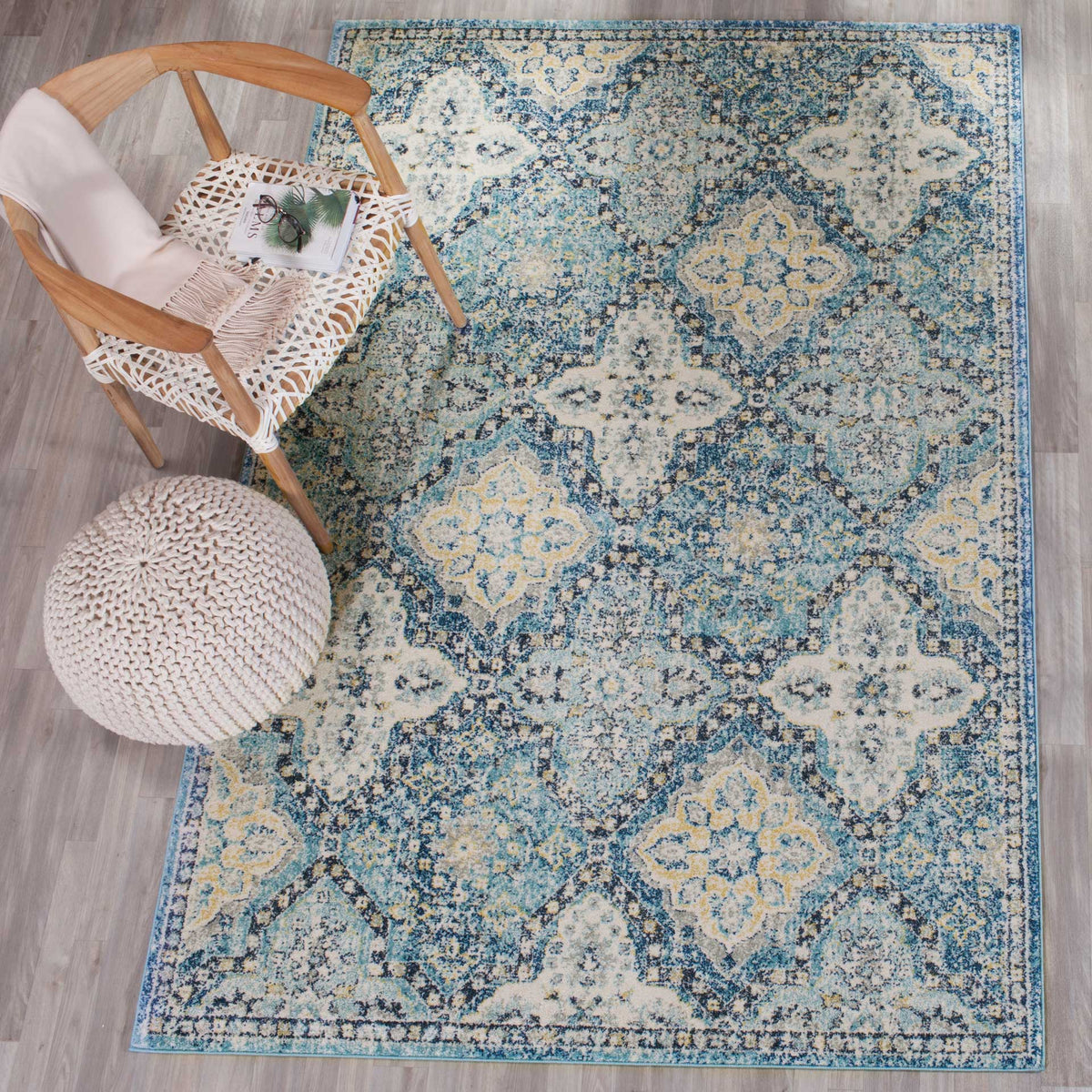 A blue and ivory medallion rug lends soft color and intricate pattern to a cozy seating area