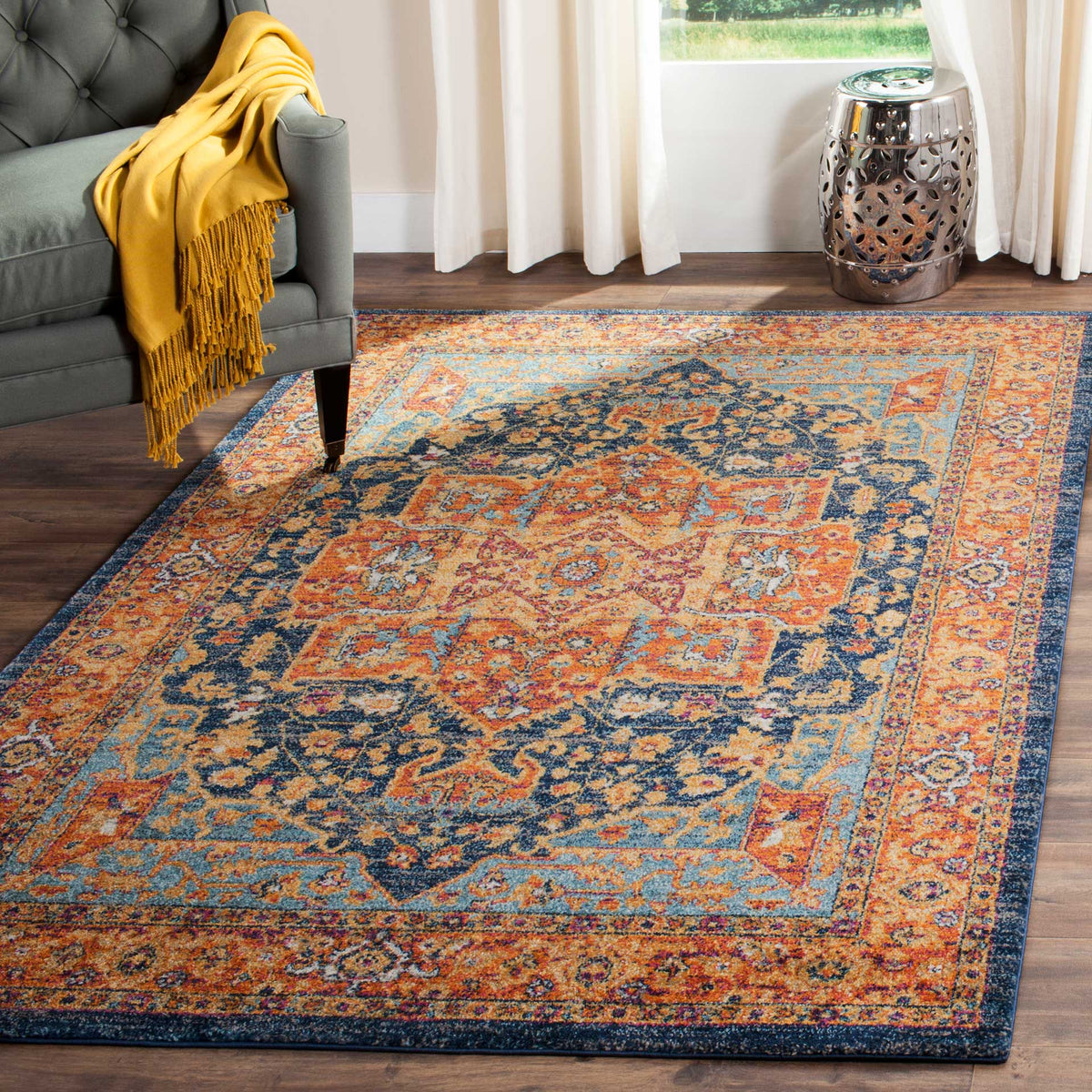 Bright orange and deep blue motifs anchor a welcoming living area with timeless pattern.