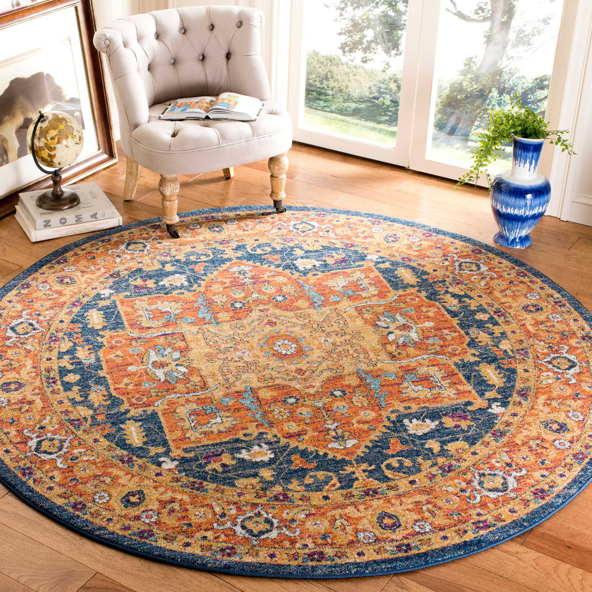 Blue and orange medallion rug brings ornate color to a light-filled seating area
