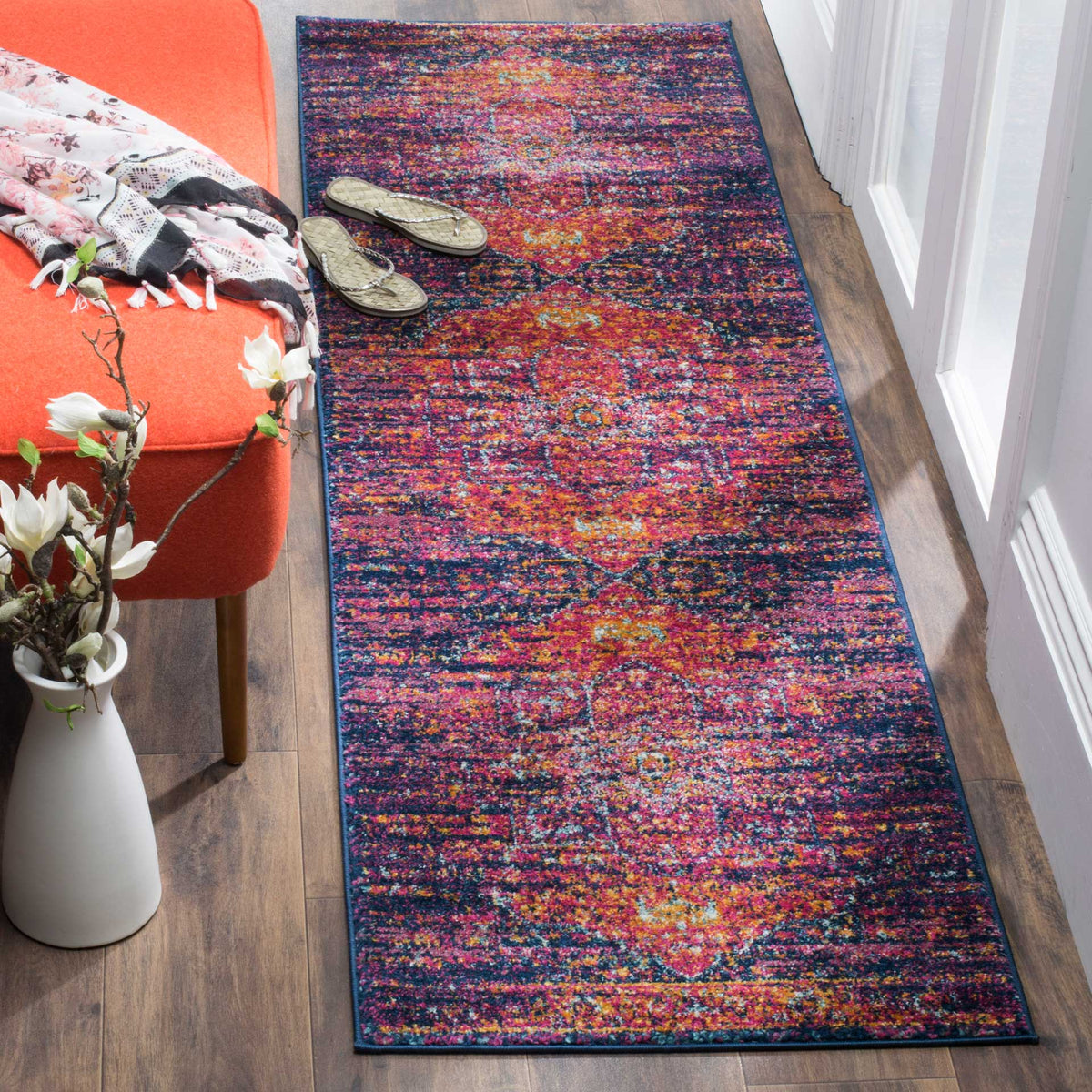 Blue and fuchsia runner brings vibrant, vintage-inspired pattern to a hallway