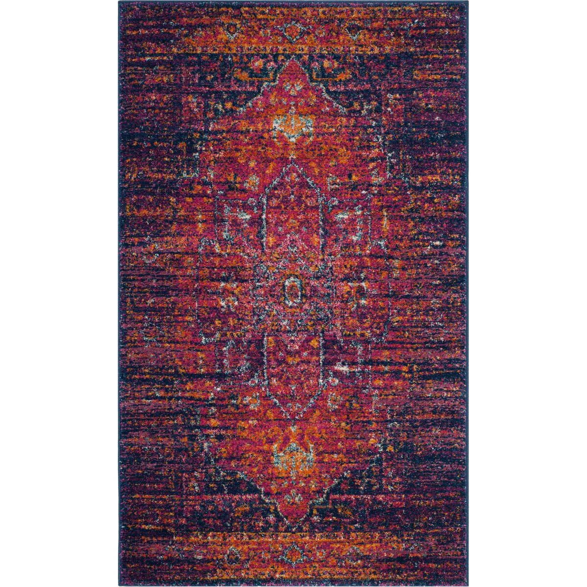A compact rug layers a fuchsia medallion over deep blue with warm, timeworn highlights.