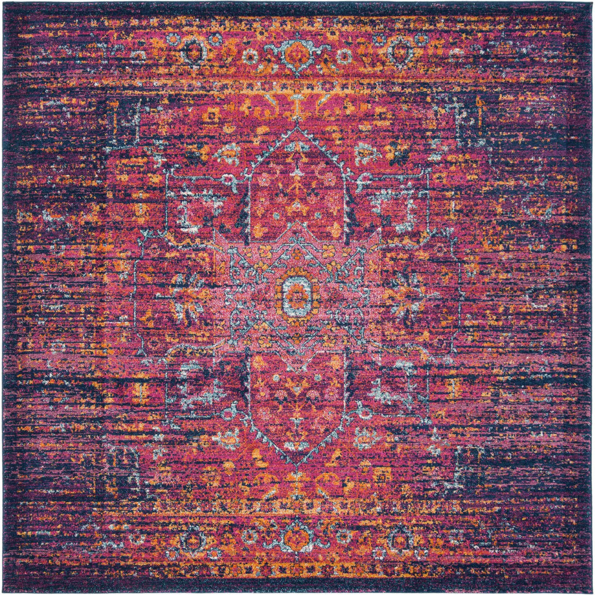 A square rug centers fuchsia scrollwork amid deep blue tones and scattered amber accents.