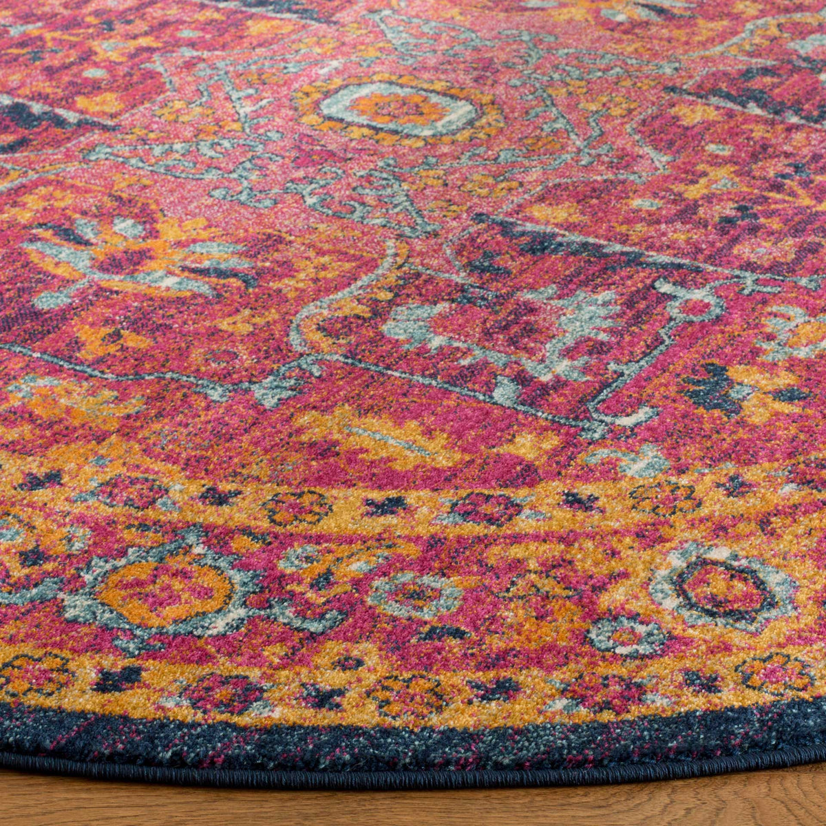 Fuchsia and orange florals reveal turquoise accents and a neatly bound dark blue edge