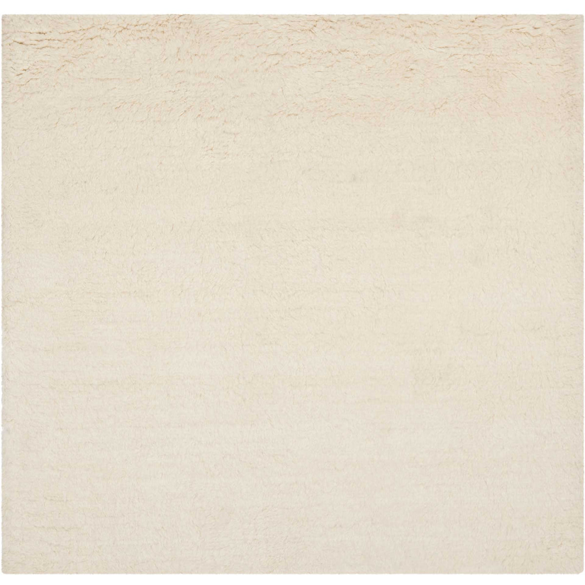 A square ivory wool rug offers plush texture and a quietly elegant solid-color design