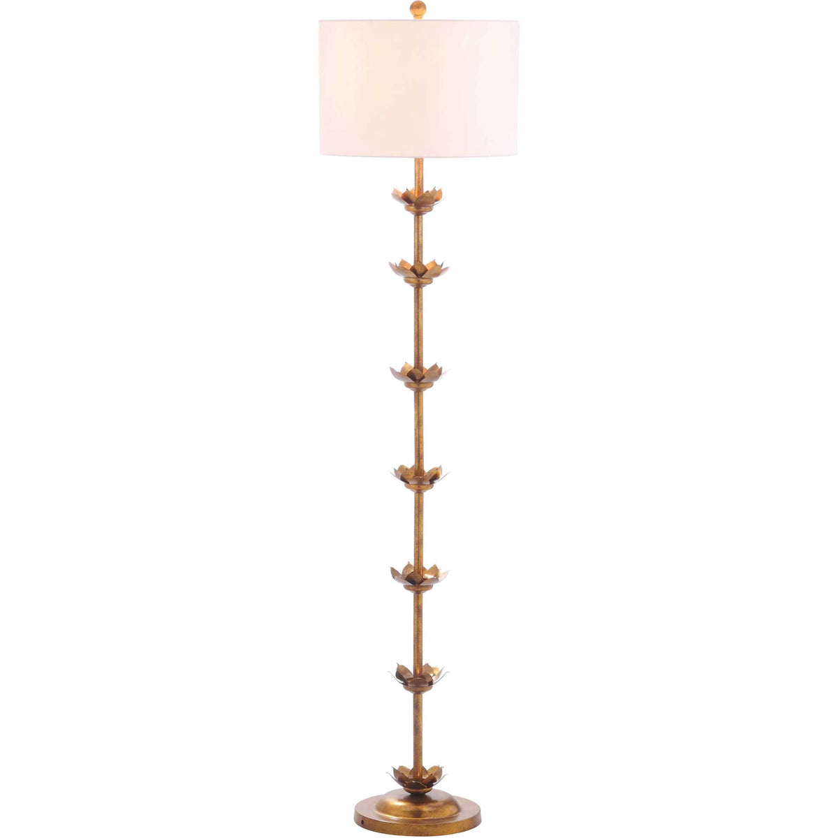 Warm light glows through an off-white drum shade above a slender stem adorned with gold leaves.