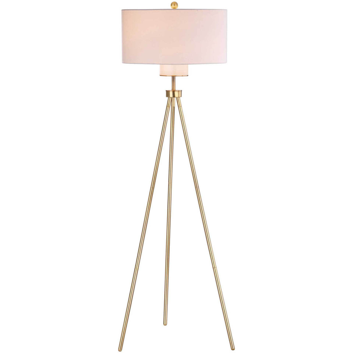 Warmly glowing drum shade tops a slender brass-finished tripod floor lamp