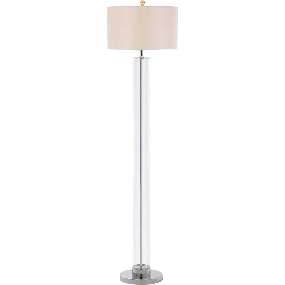 Soft light warms the drum shade above a clear glass column and polished chrome base.