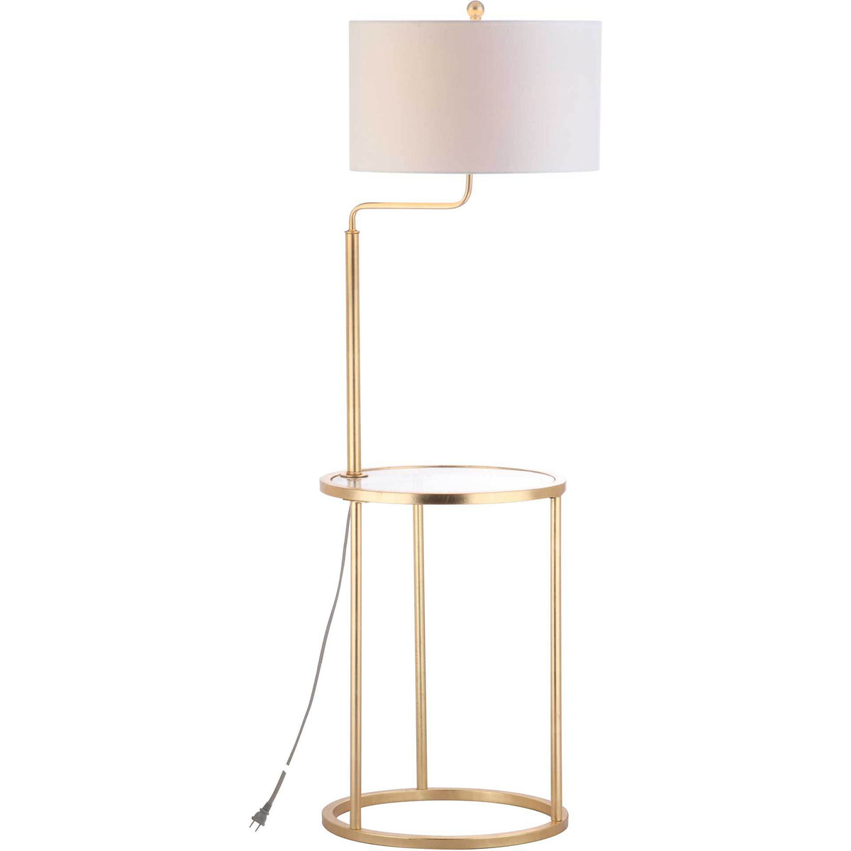 A softly glowing drum shade tops a gold floor lamp with a clear tabletop and open circular base.