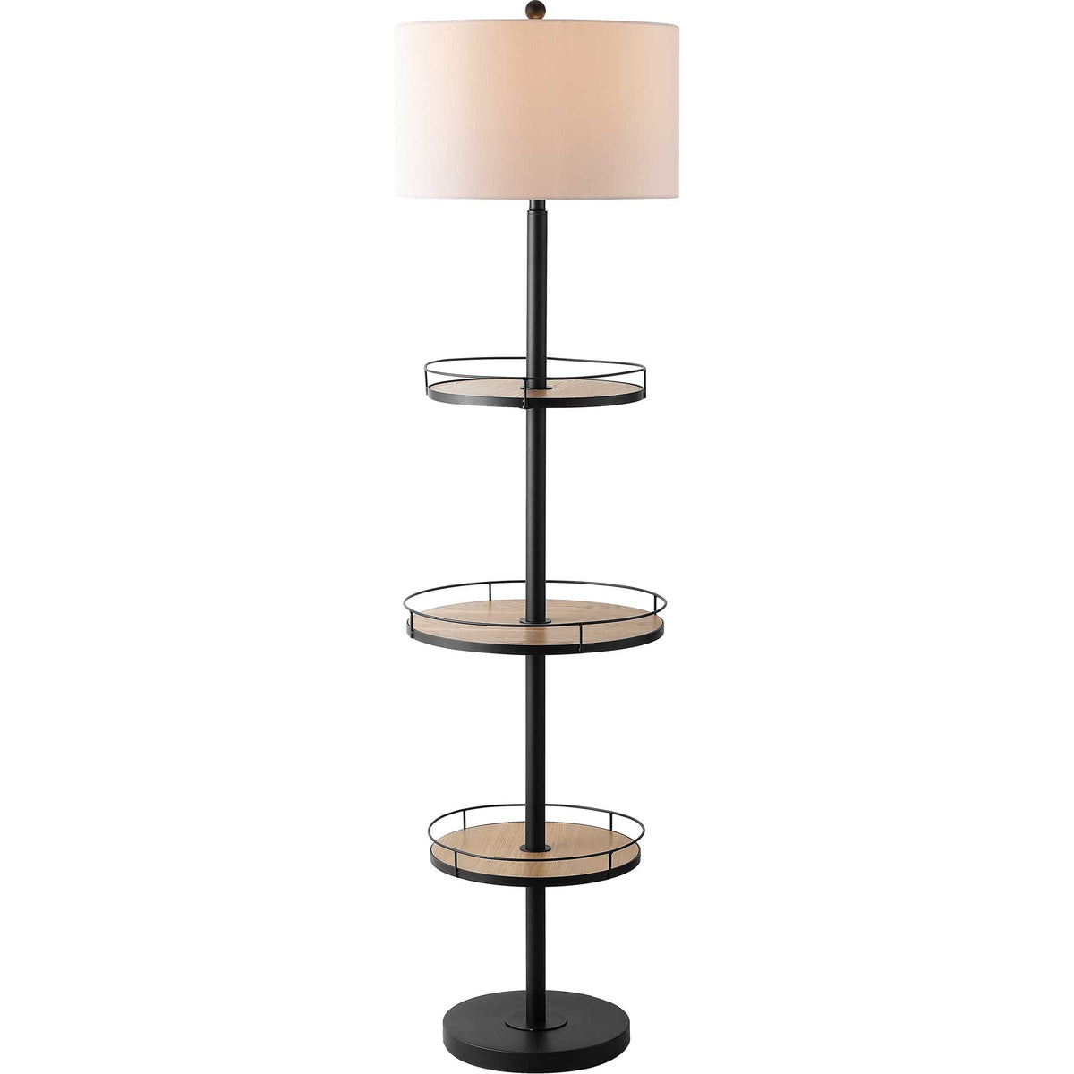 A glowing drum shade warms a black floor lamp with three wood-tone display shelves