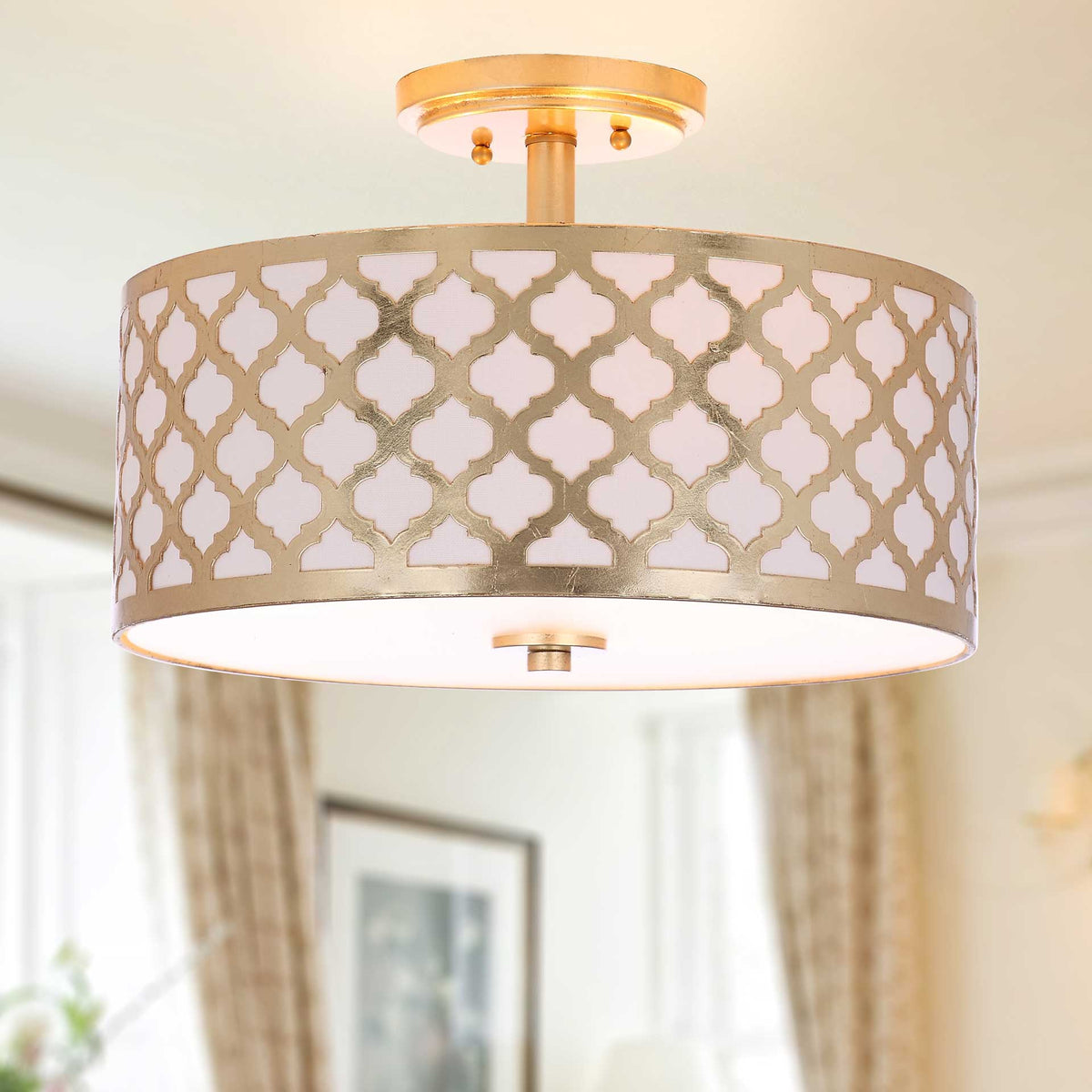 Soft illumination warms the patterned shade and gold accents above the living space