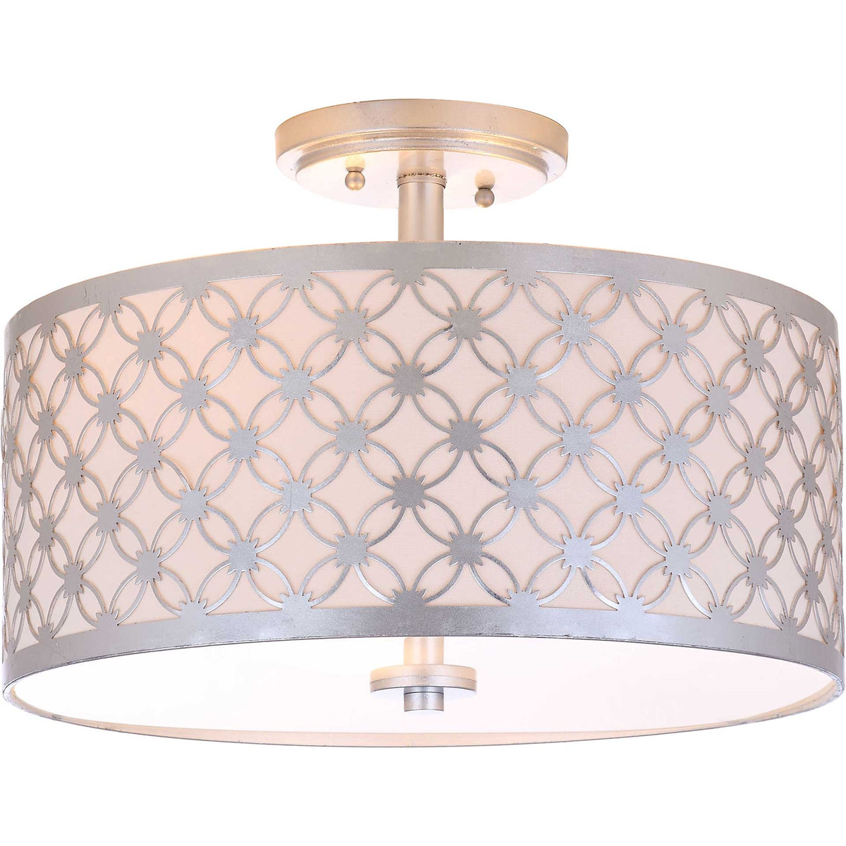 A silver floral lattice gleams against the warm glow of a fabric-lined shade