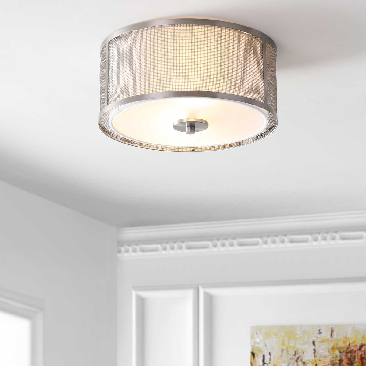 Ceiling-mounted drum fixture casts a soft glow through its textured shade and white diffuser