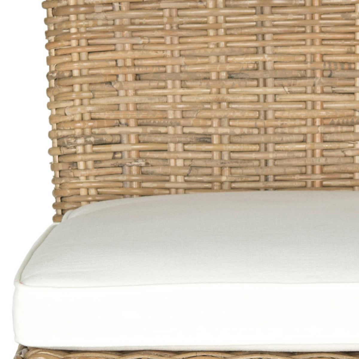 Tightly woven natural rattan brings earthy texture beside a thick, smooth white seat cushion.