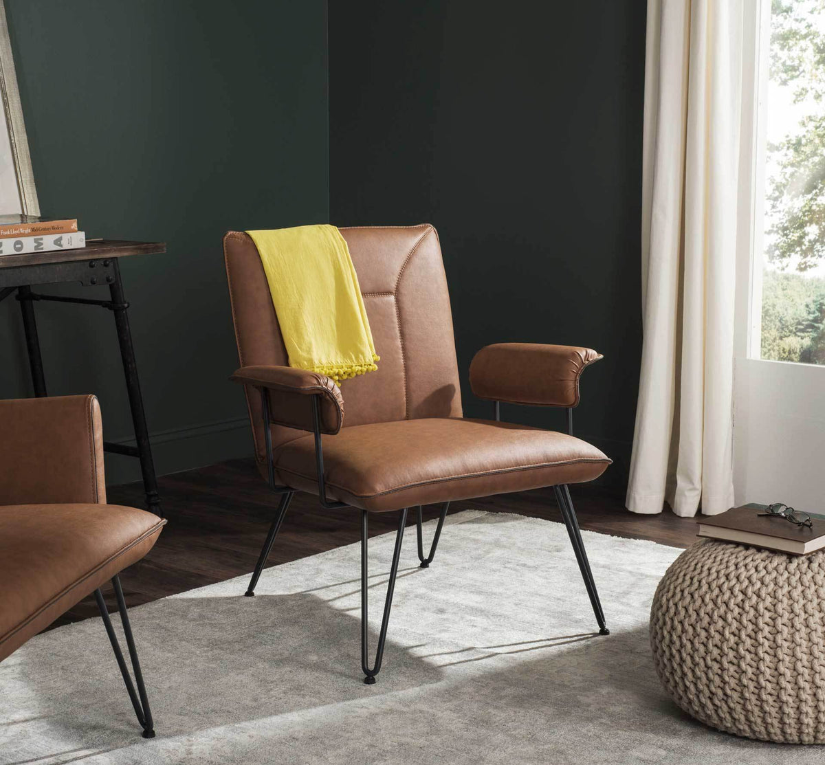 Retro camel armchair with padded arms and a tailored back brings warmth to a modern space