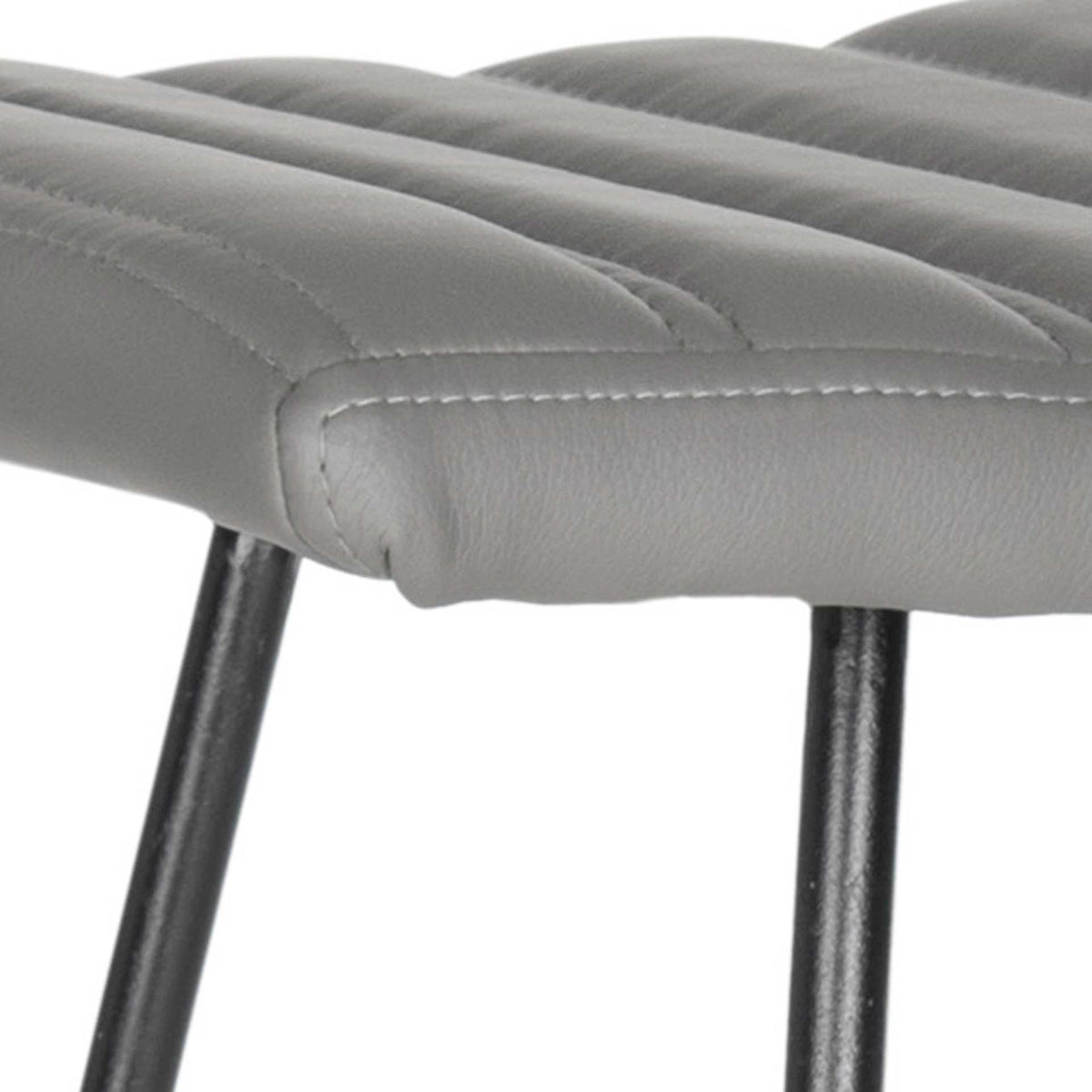 Gray faux leather, stitched channels, and a rounded seam define the padded seat.