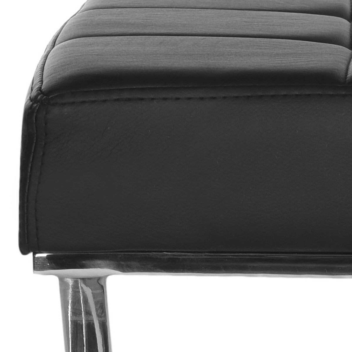 Padded black upholstery features stitched channels and a smooth side above a polished steel leg.