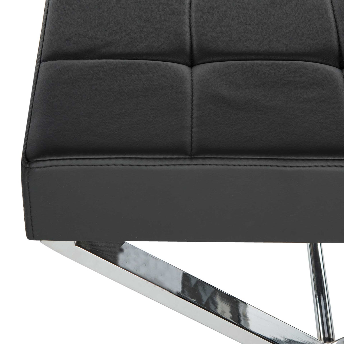 Neat stitching outlines the black tufted seat above a reflective chrome frame