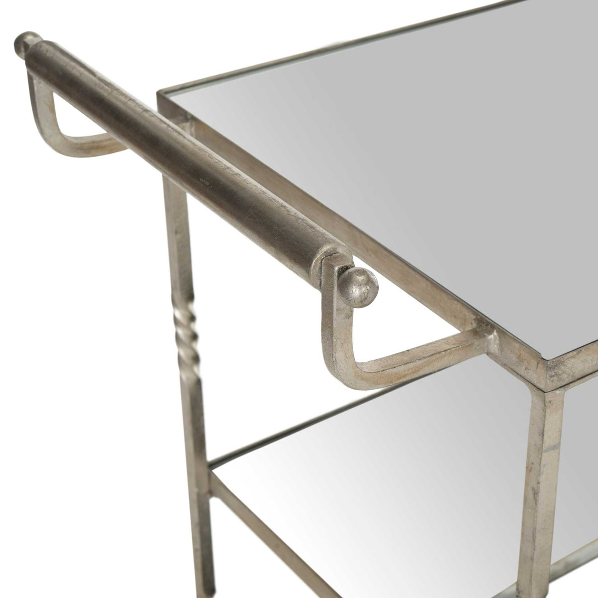 A rounded silver handle adds a refined finishing touch to the mirrored bar cart.