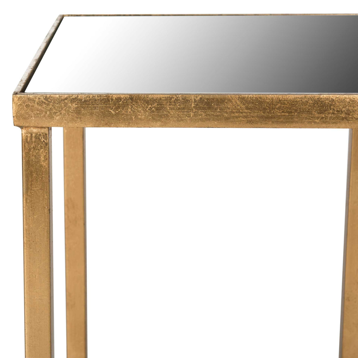 A reflective tabletop sits within a textured antique gold metal frame.