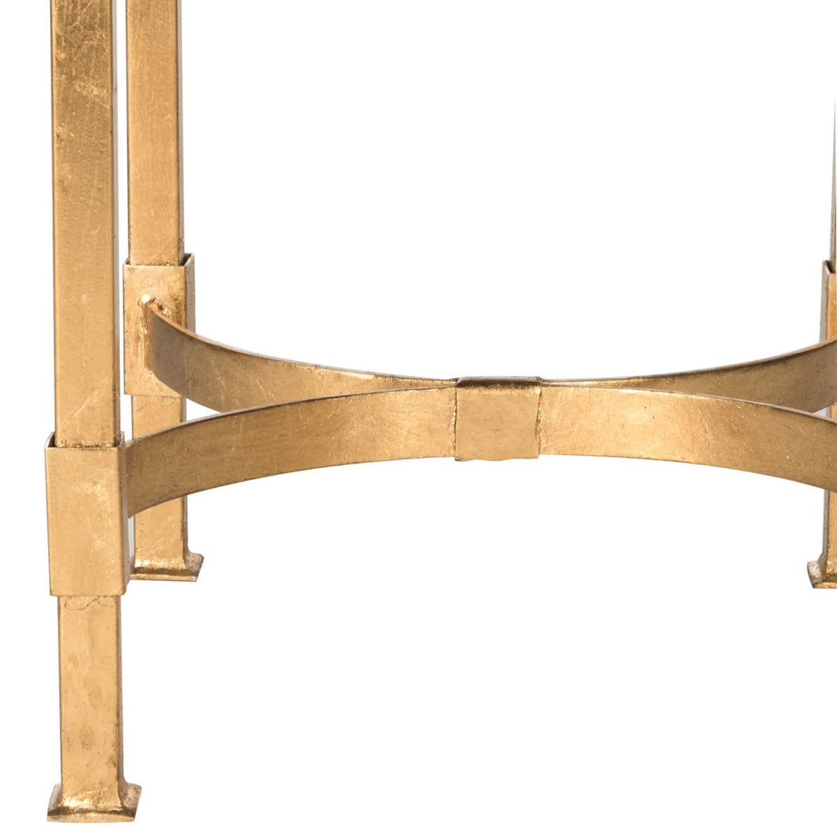 Slender gold legs and curved crossbars give the table sculptural support. || FOX2567A || leg_studio
