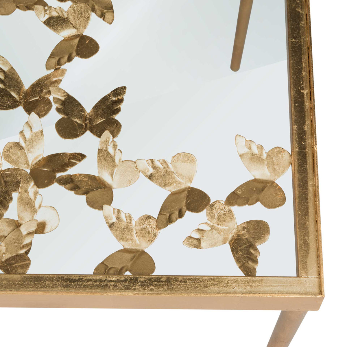 An antique gold border frames delicate butterflies beneath the clear glass tabletop.