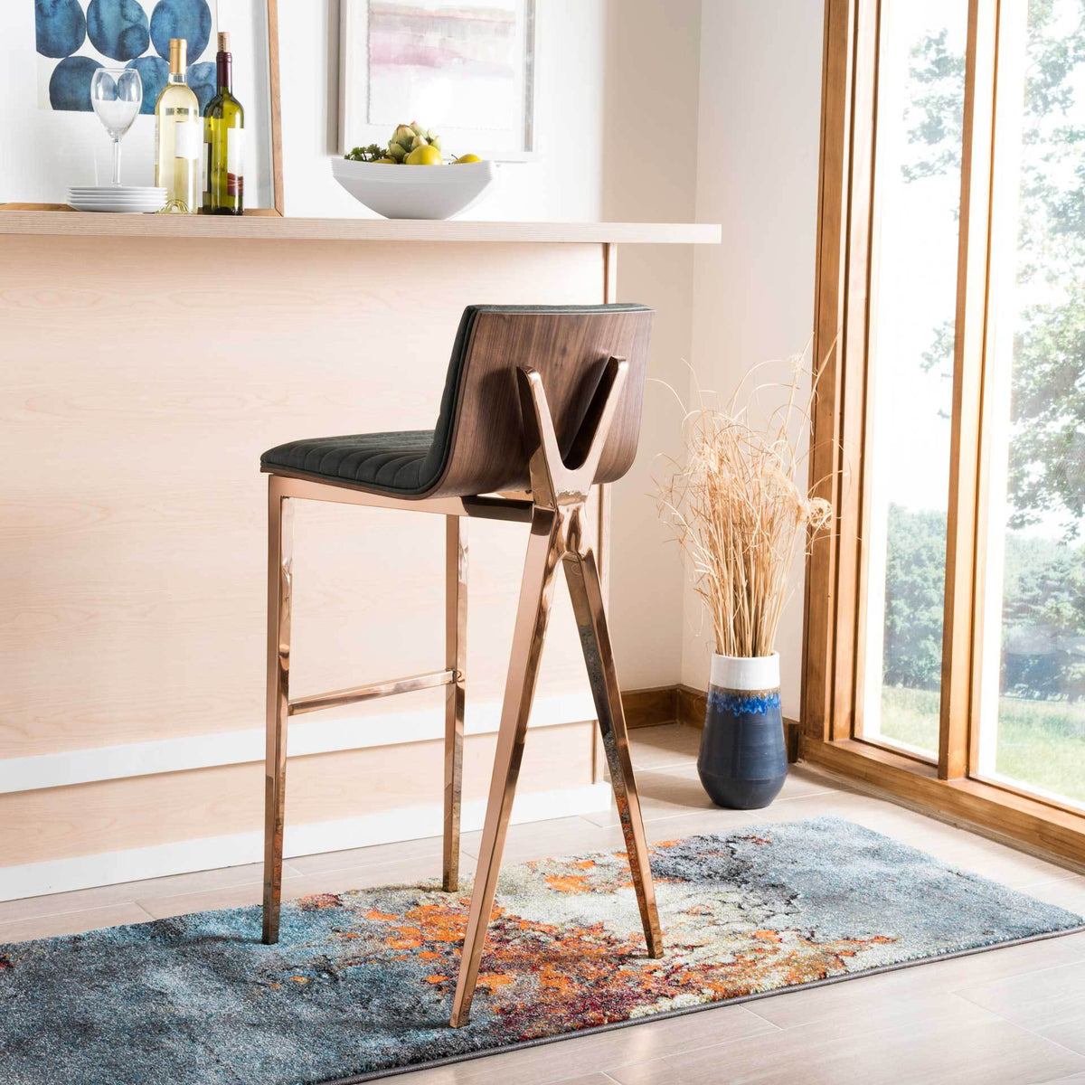 Wood-grain back and copper-finished legs add warmth to an ash green bar stool