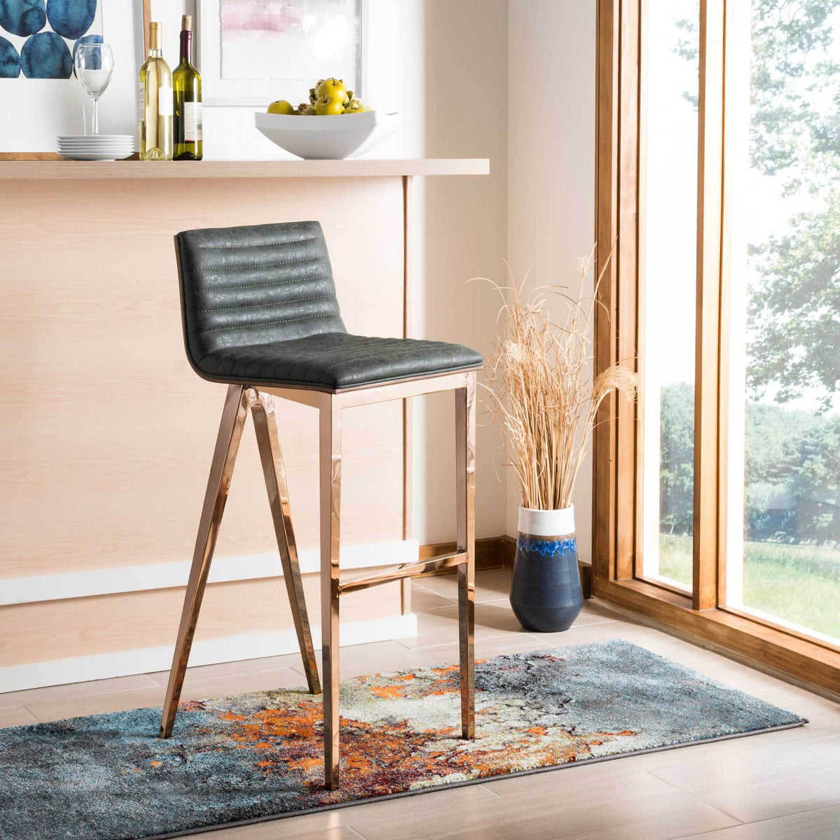 Ash green tufted bar stool brings copper-finished accents to a bright bar area