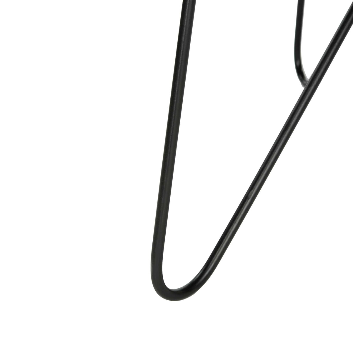 A slim black hairpin leg sweeps into a rounded loop beneath the table.