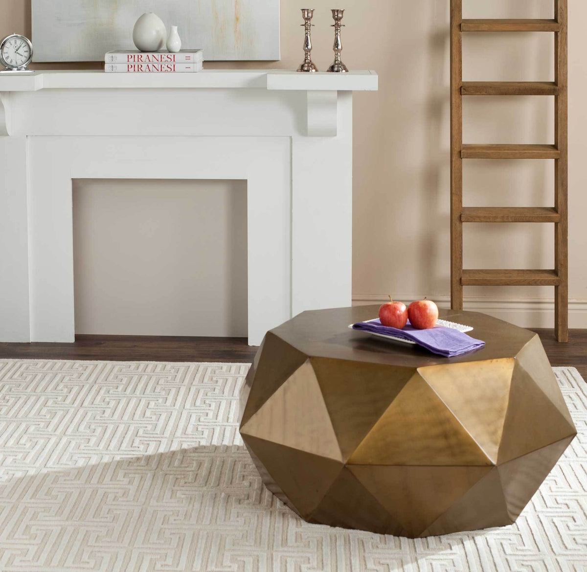Low-profile brass coffee table brings warm metallic sheen and bold geometric texture to a living room