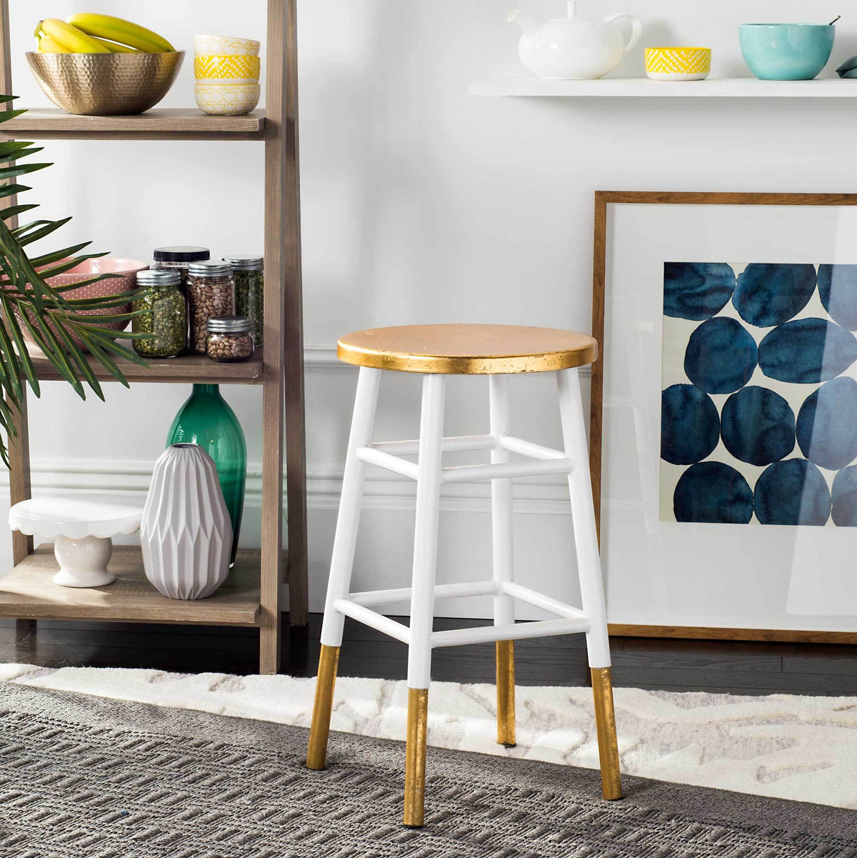 White and gold counter stool pairs a metallic seat with an airy geometric frame
