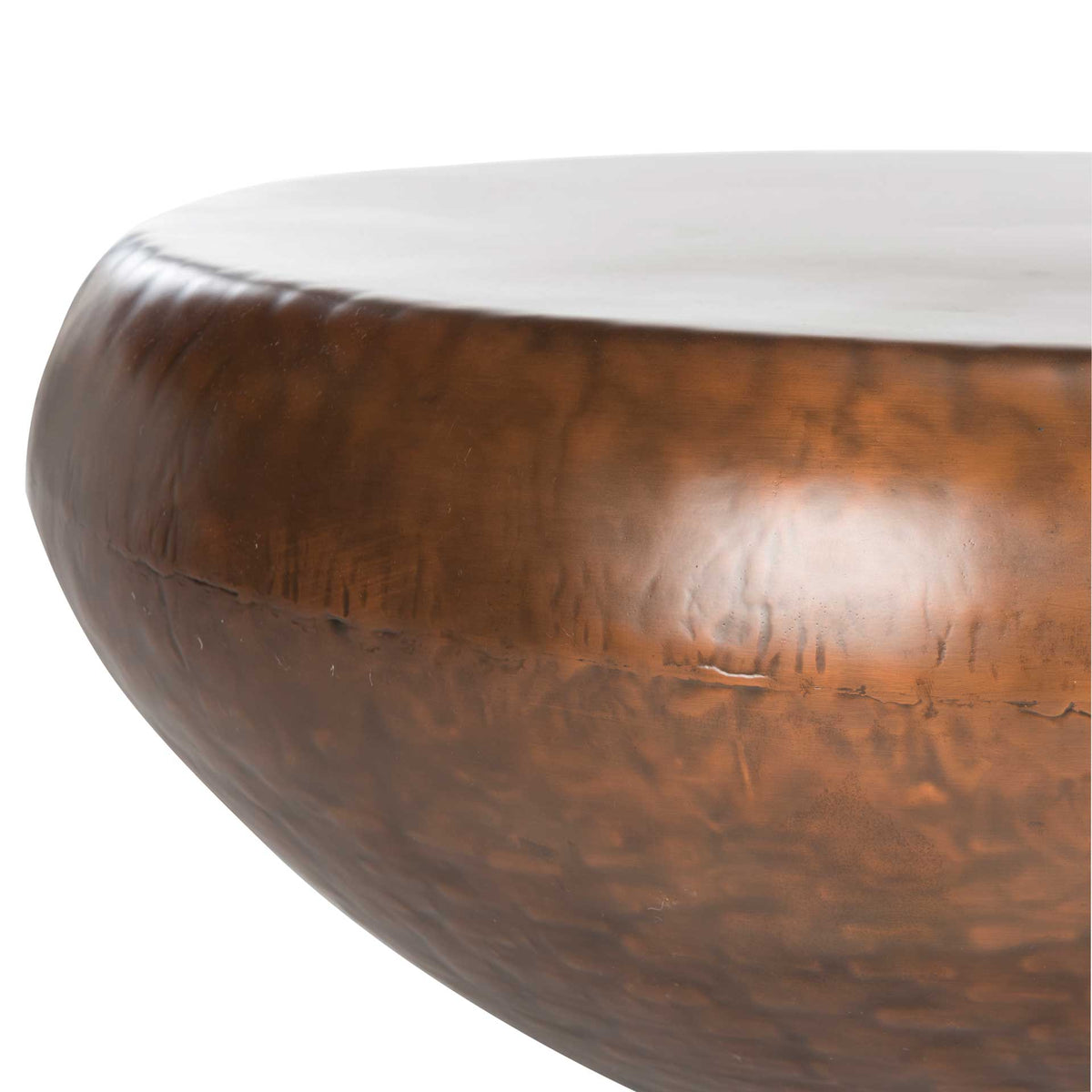 Hammered metal texture and warm copper highlights accent the softly curved sides