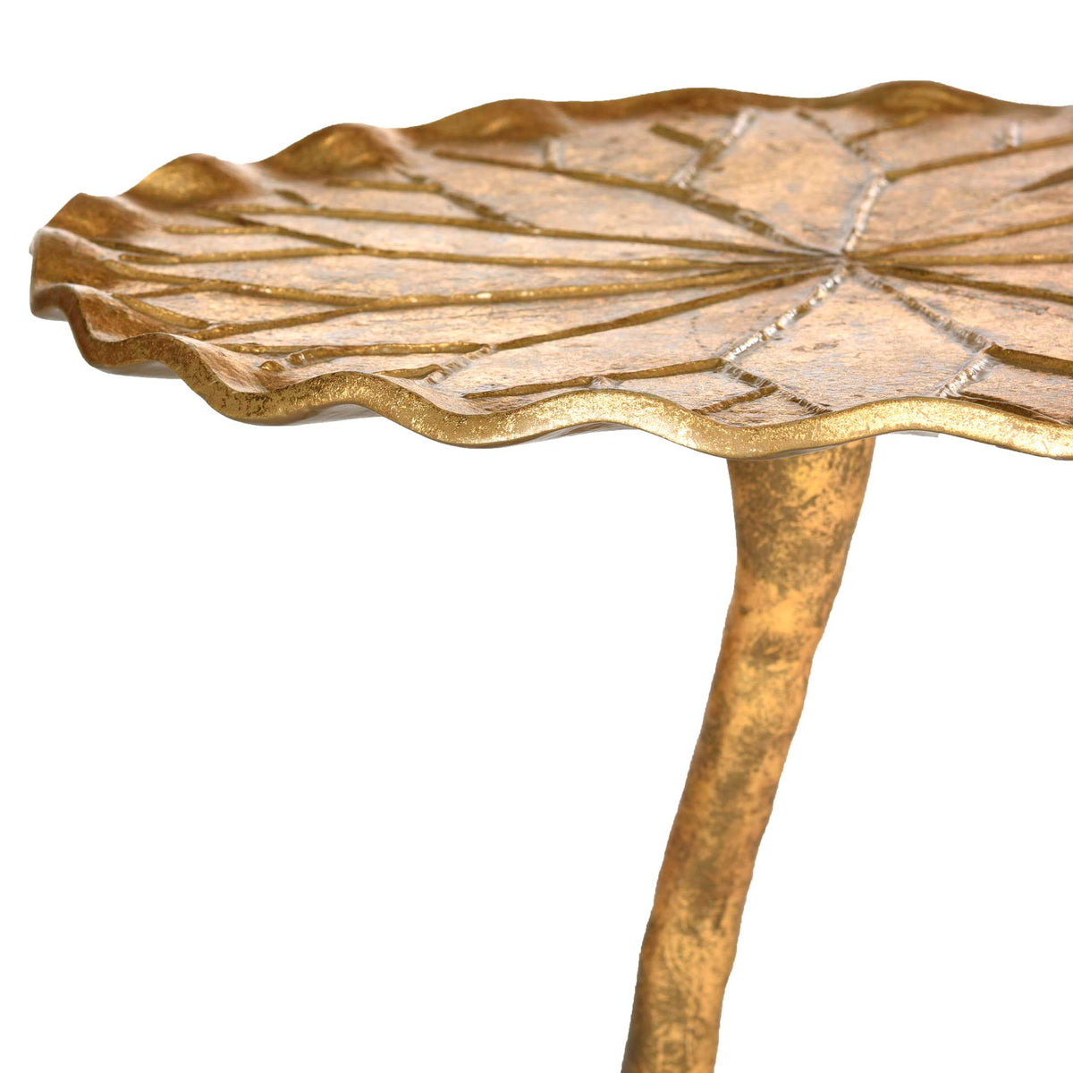 The rippled edge of the gold leaf-shaped top meets a slender, organically curved stem