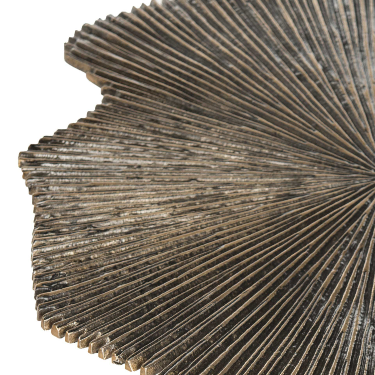 Raised leaf veins and scalloped edges give the tabletop rich texture