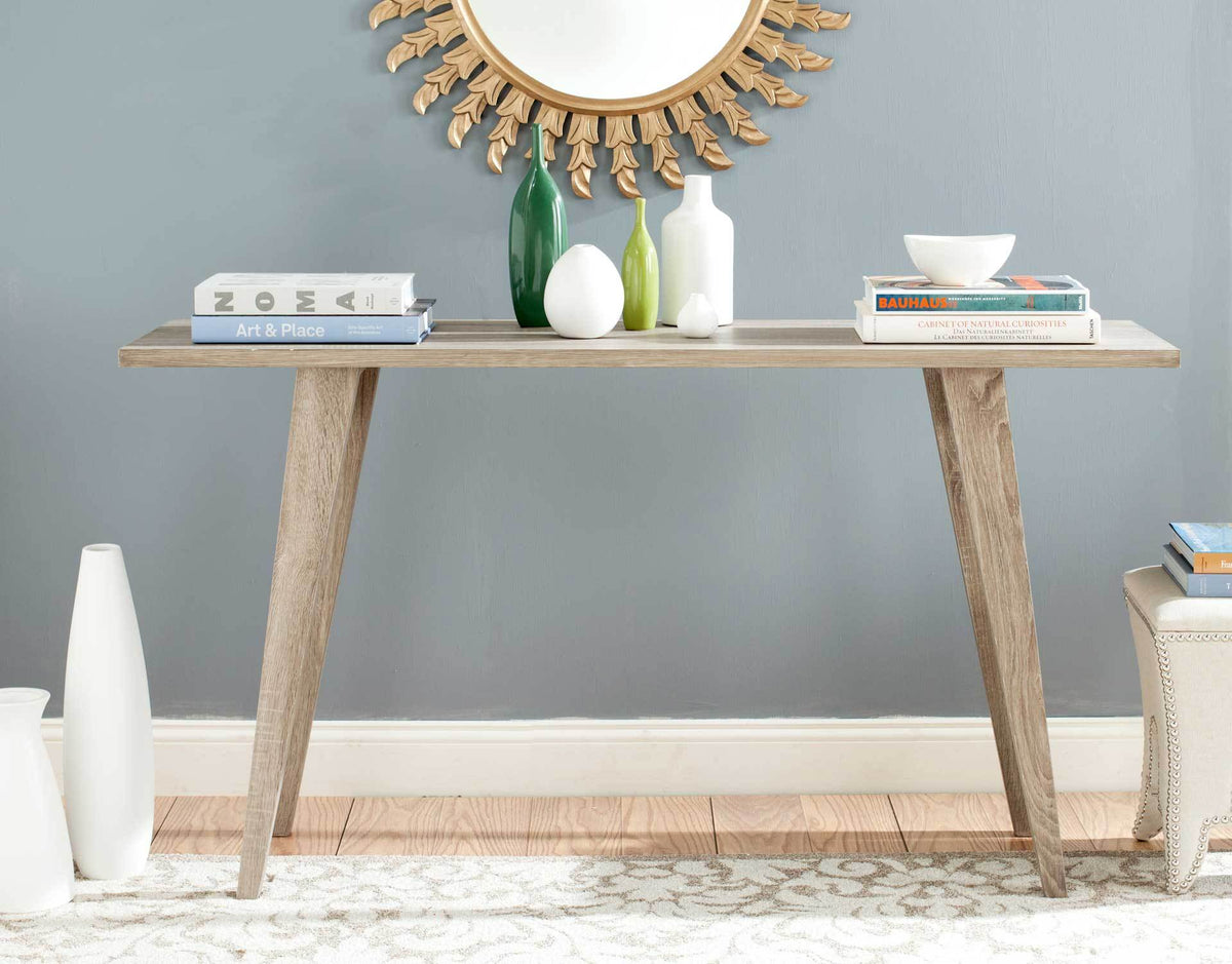 Oak-look console table brings natural texture and open lines to a living space