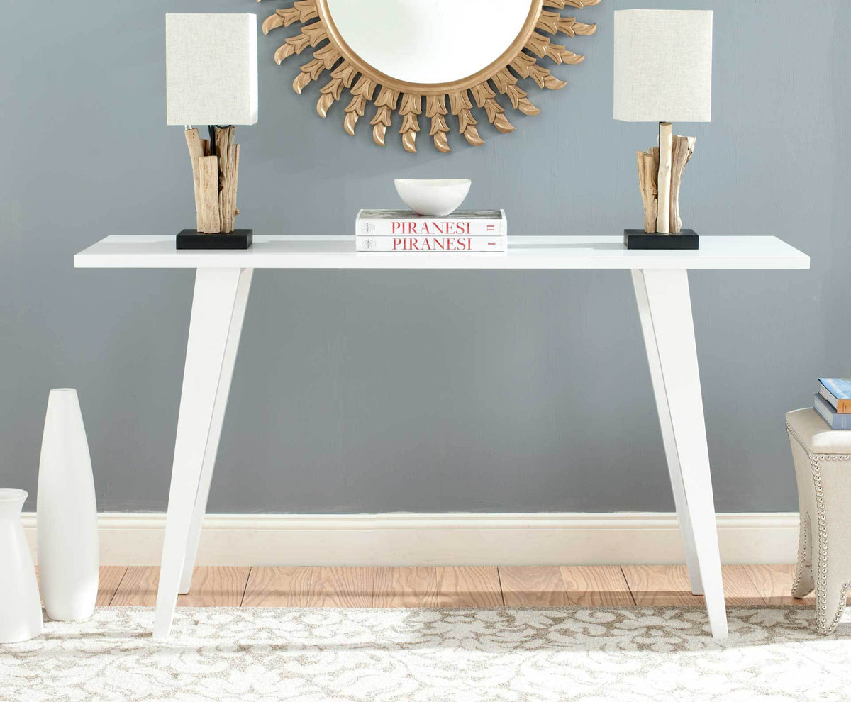 Sleek white console table offers an airy display surface for an entryway