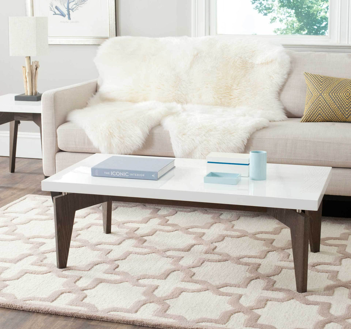 A white lacquer top and dark brown wood-grain legs add clean-lined style to a cozy living room.