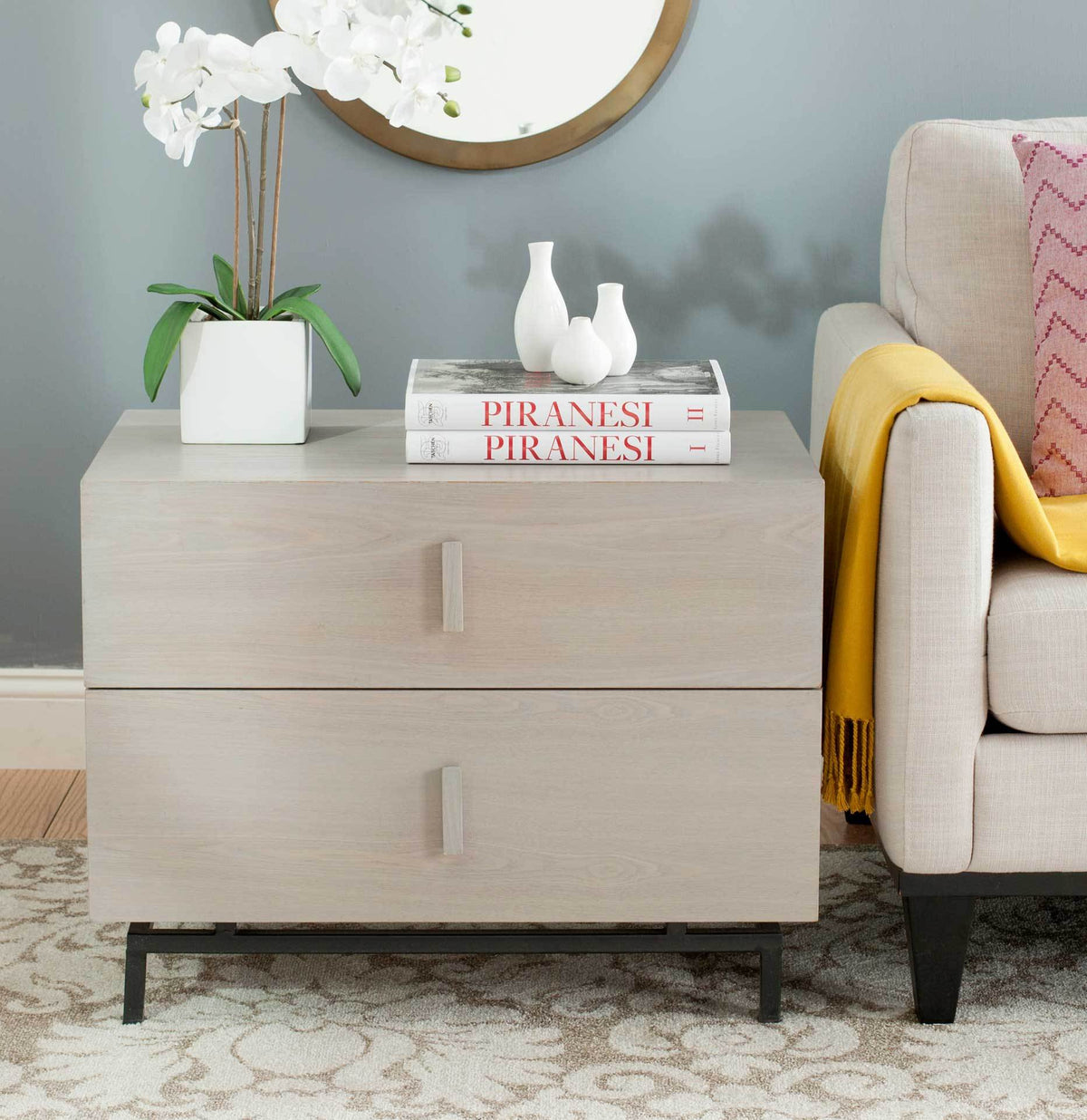 Light gray cabinet pairs two roomy drawers with a clean-lined black metal base
