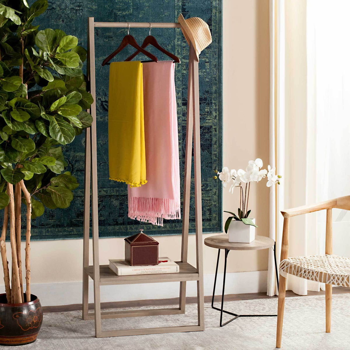 This light oak coat rack keeps scarves and hats handy while a lower shelf holds smaller items
