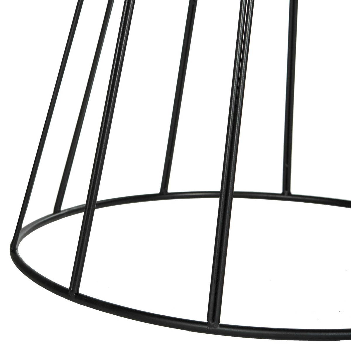 Slender black iron supports meet a circular base for an airy, geometric look