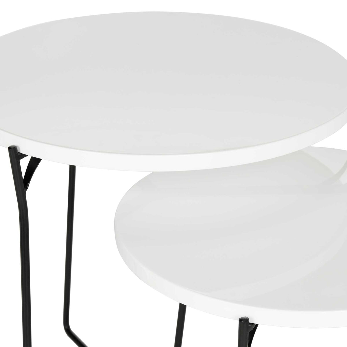 Smooth white circular tops contrast with the slender black iron framework.
