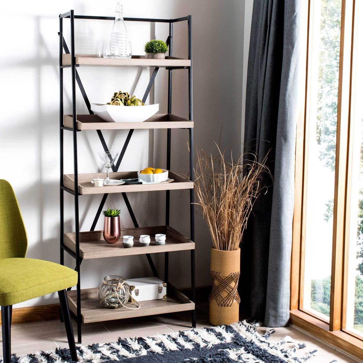 Light brown shelves display plants and decor within a slim black metal frame