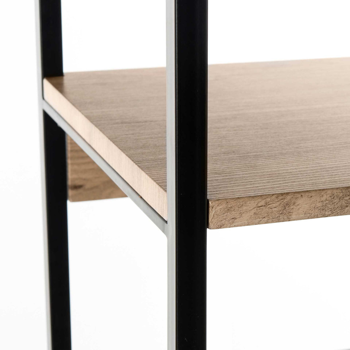 An oak-look shelf edge meets black iron supports in a crisp industrial contrast