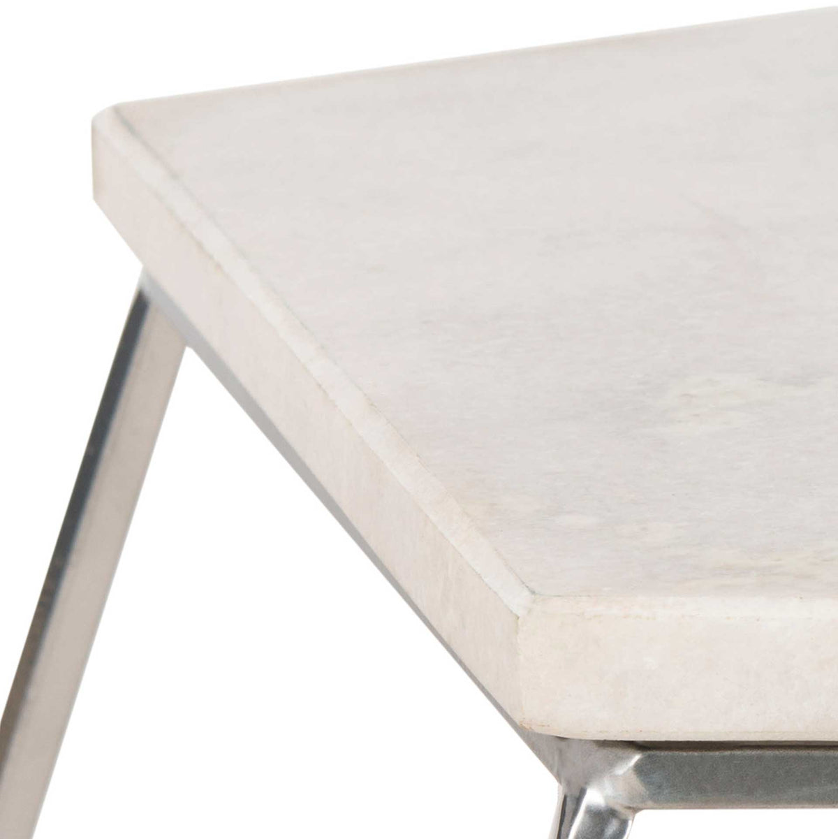The pale marble top has a clean edge above the slender silver metal frame.